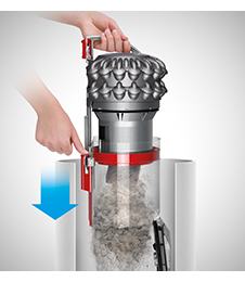 Dust being emptied into a bin at the push of a button.